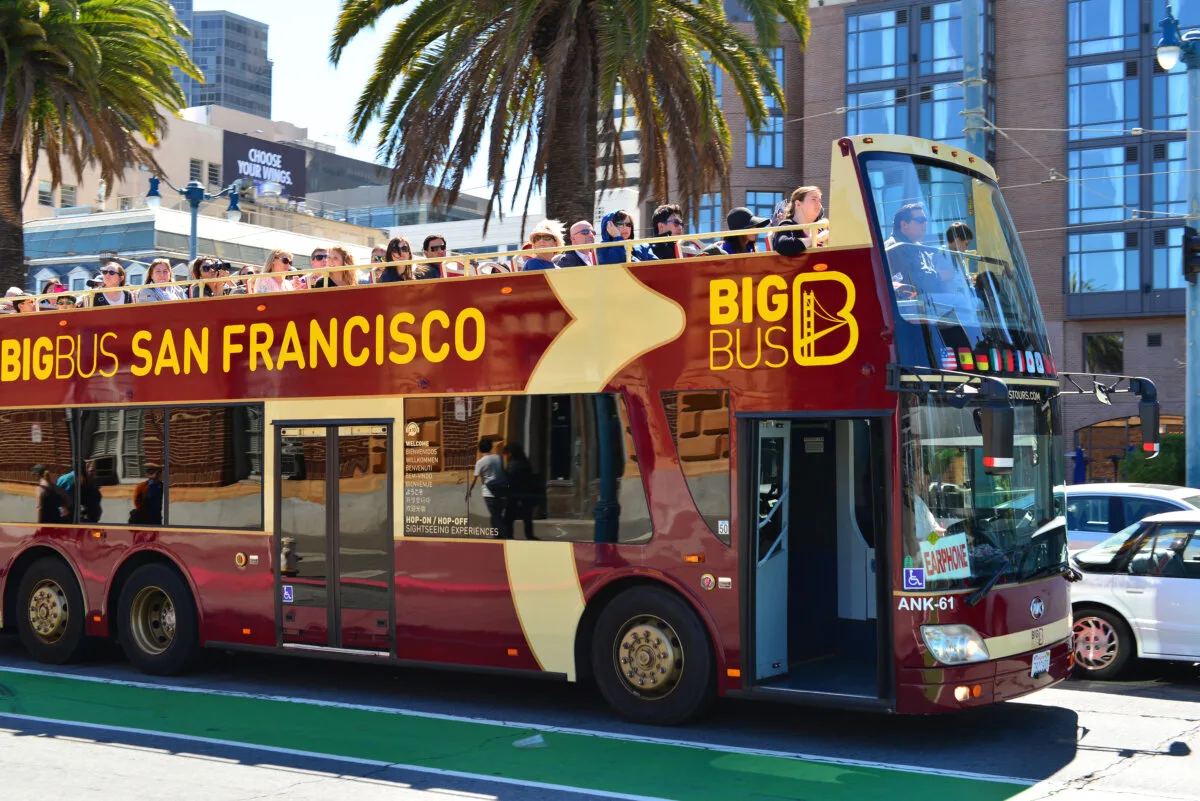 San Francisco passengers riding on the top tier of a double-decker tour bus are treated to a magnificent view of the city.