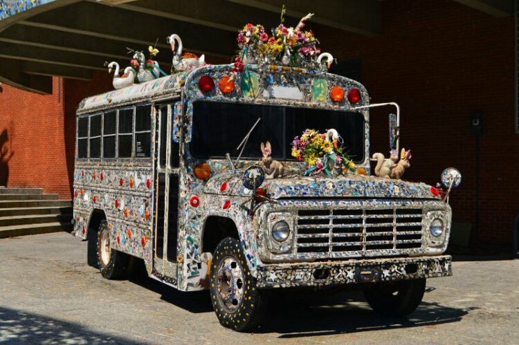  A decorated school bus stands outside of the American Visionary Art Museum