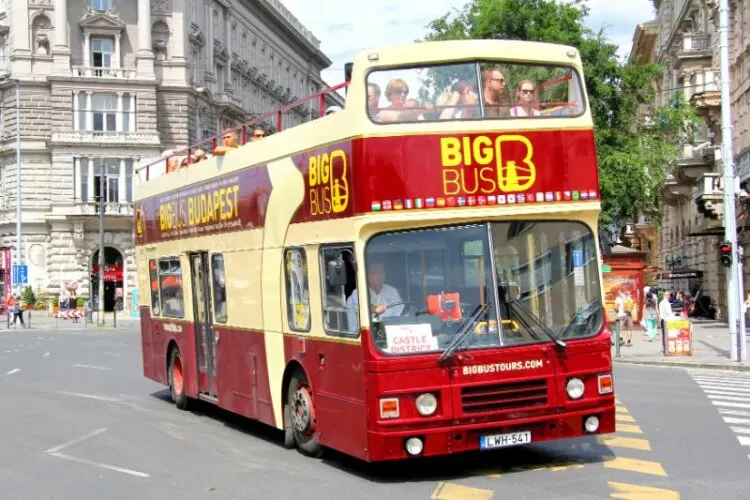 Big bus carrying tourist along the road