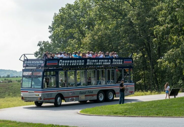 A filled double decker tour bus