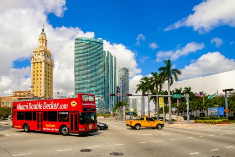 double decker tour bus passing by Downtown Miami