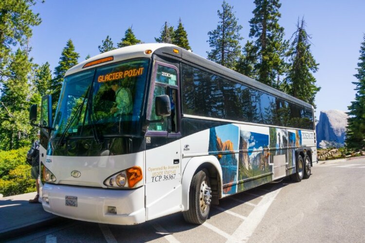 Side view of The Yosemite Glacier Point guided tour bus,