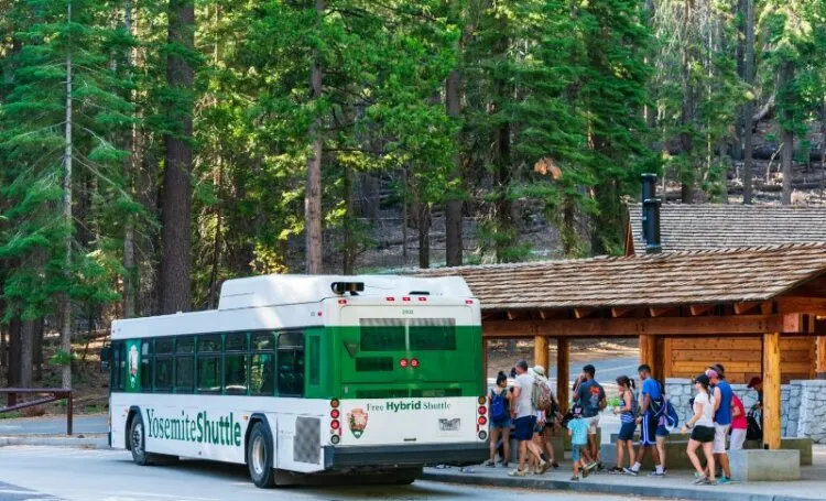 Tourists board free  shuttle bus