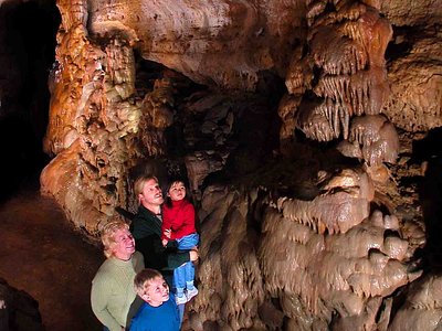 tourists admiring the stalactites at a cave in blue mounds