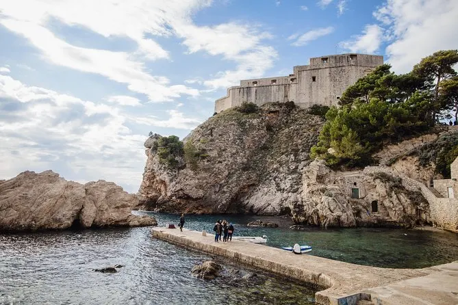 visitors taking selfies at the famous game of thrones location in dubrovnik