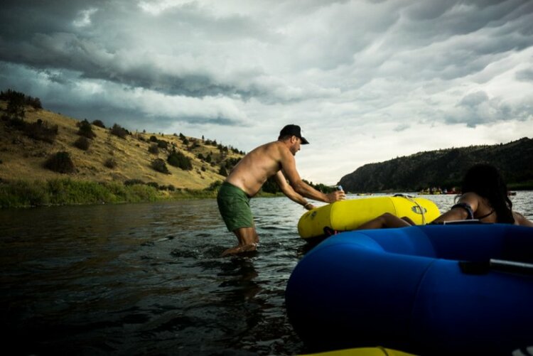 Man holding Inner-tubing in the water