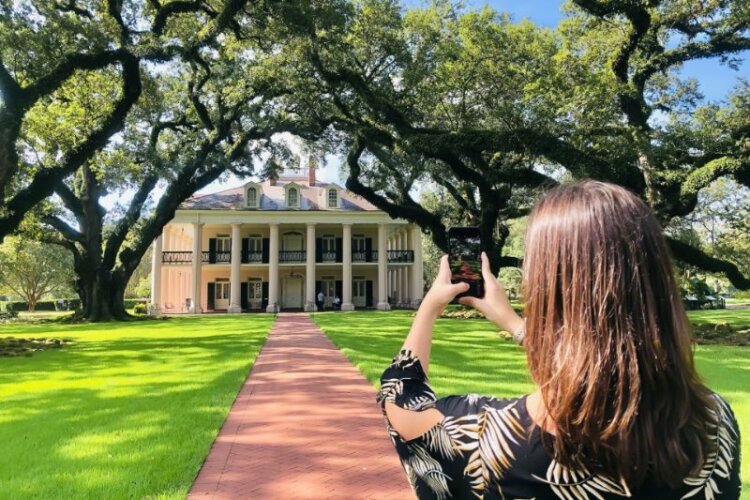 Women clicking photo through her phone