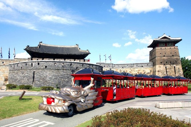 tourists riding the red trolley at Hwaseong Fortress in Suwon