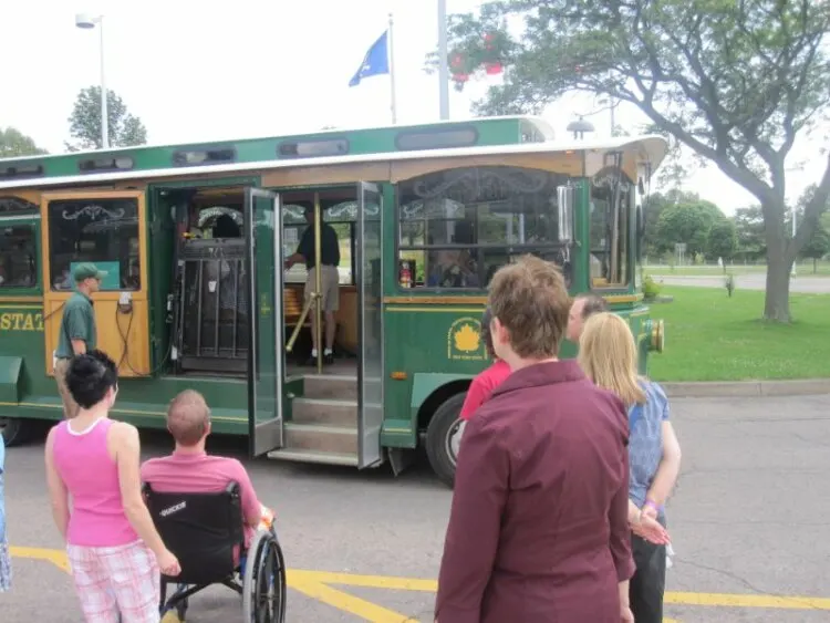 People boarding trolley bus