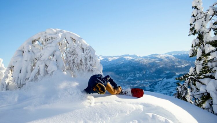 a skier on top of a snowy mountain in Voss Norway