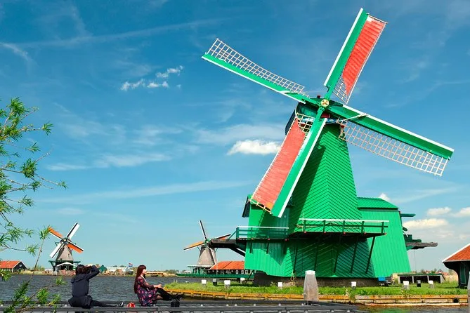 women taking photos at the windmill in the Zaanse Schans village