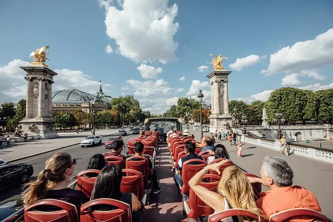 Tourist on a Big Bus Hop-On Hop-Off Tour in Paris