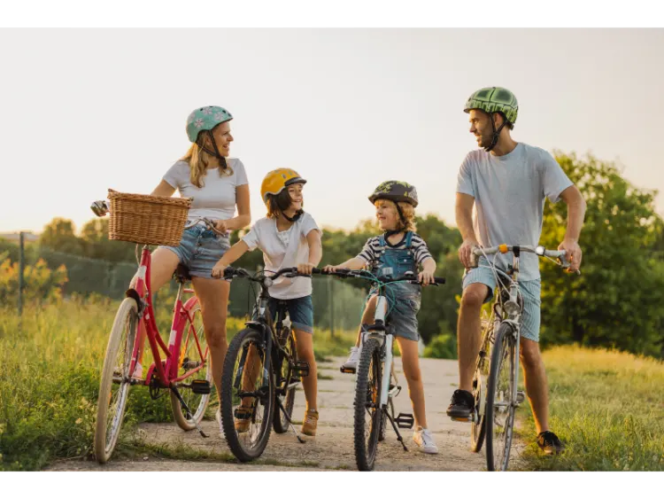 Happy family cycling together