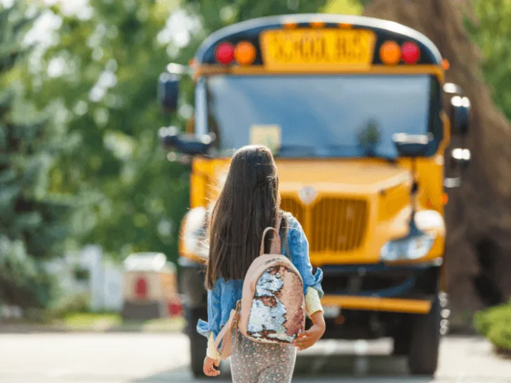 School bus and girl