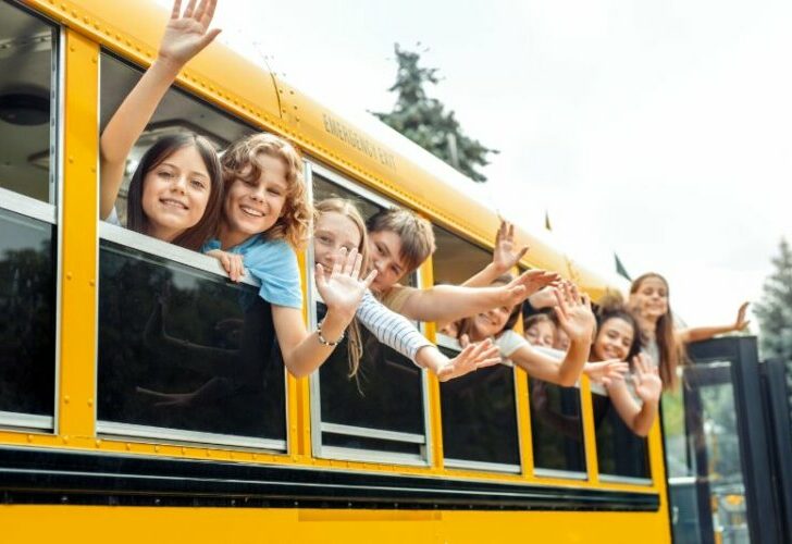 Classmates going to school by bus