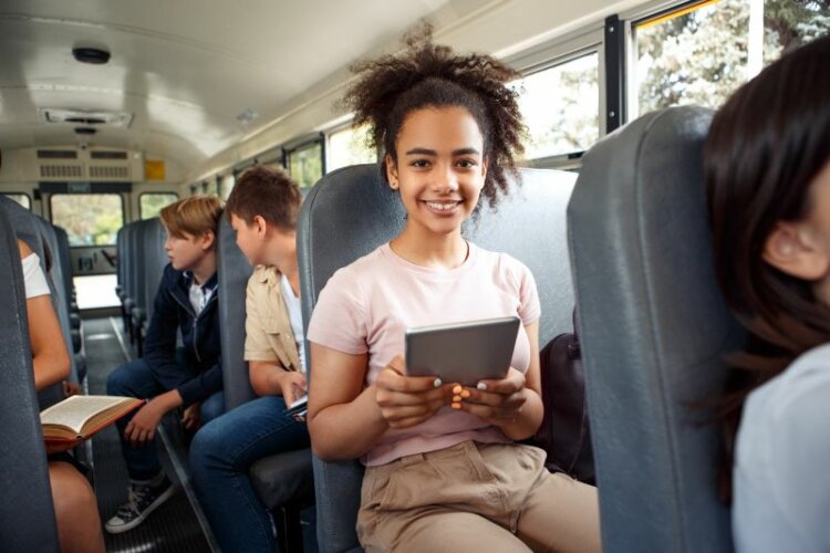 Classmates going to school by bus