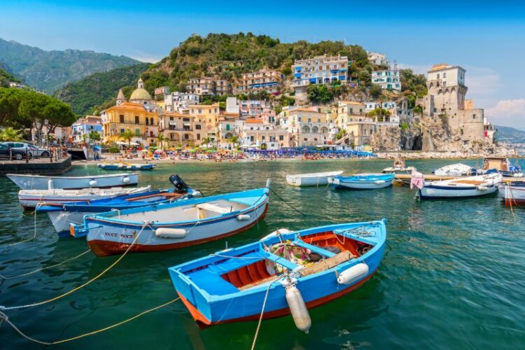 Leisure boats and traditional buildings in Cetara harbor, Amalfi coast, Italy