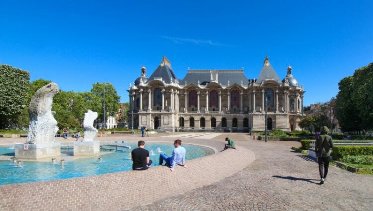 Two men relaxing at the fountain in front of Musée des Beaux-Arts 