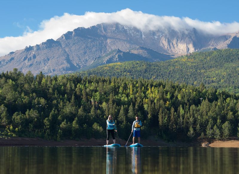 Couple paddle boarding in Pikes Peak 
