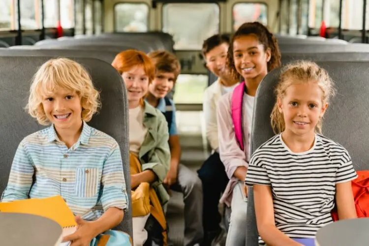 Pupils sitting inside school bus