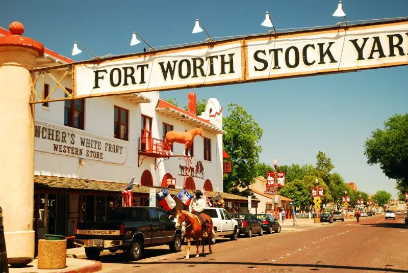 Sheriff patrols the streets of the Fort Worth Stockyards while riding on a horse
