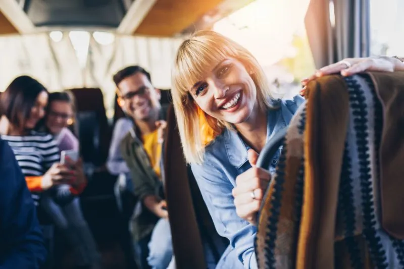 Smiling solo bus rider