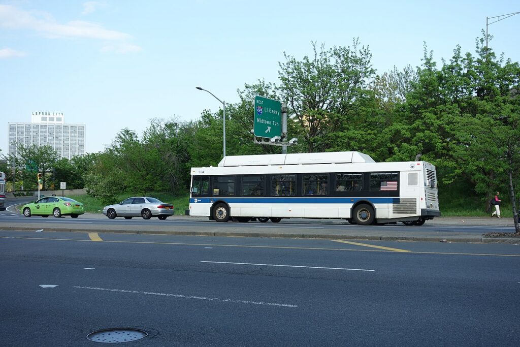 A Corona-bound Q38 bus traveling north on Woodhaven Boulevard underneath the Long Island Expressway in Elmhurst, Queens.