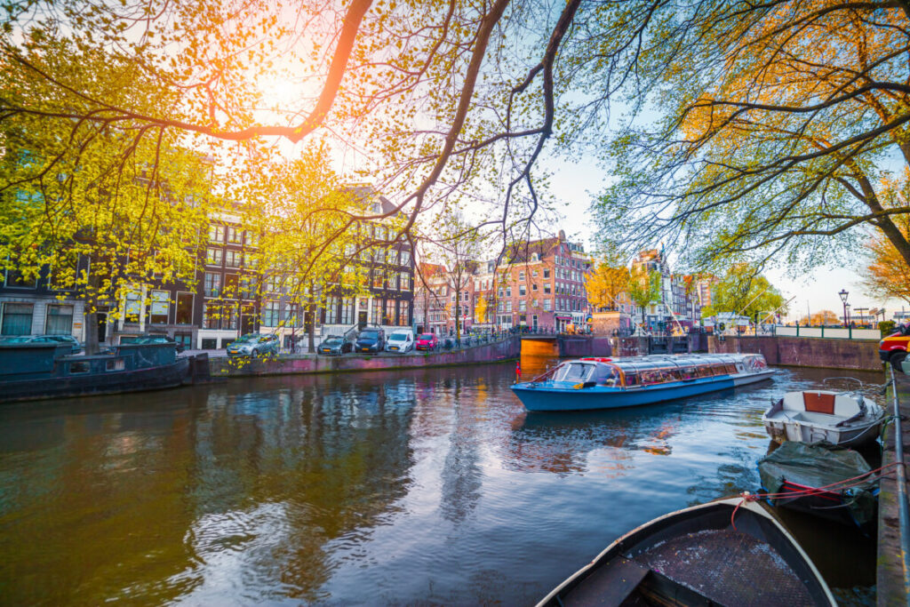 Scenic view of a canal cruise in Amsterdam, Netherlands