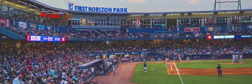 Exciting Nashville Sounds baseball game at First Horizon Park with passionate fans and vibrant stadium lights.