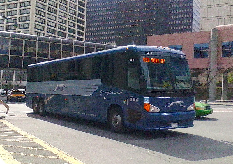 Greyhound New York Bus driving around a road in New York