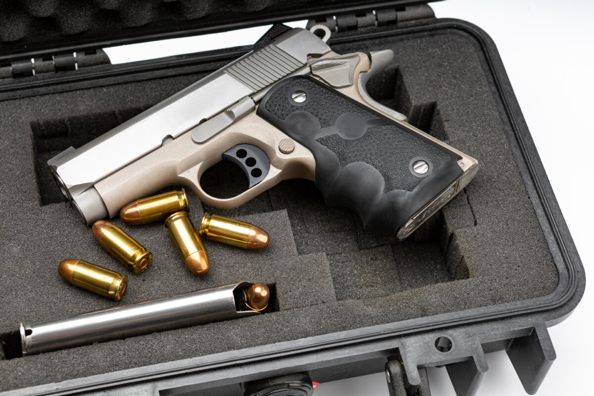 Handgun resting on a table, representing items banned from Greyhound buses