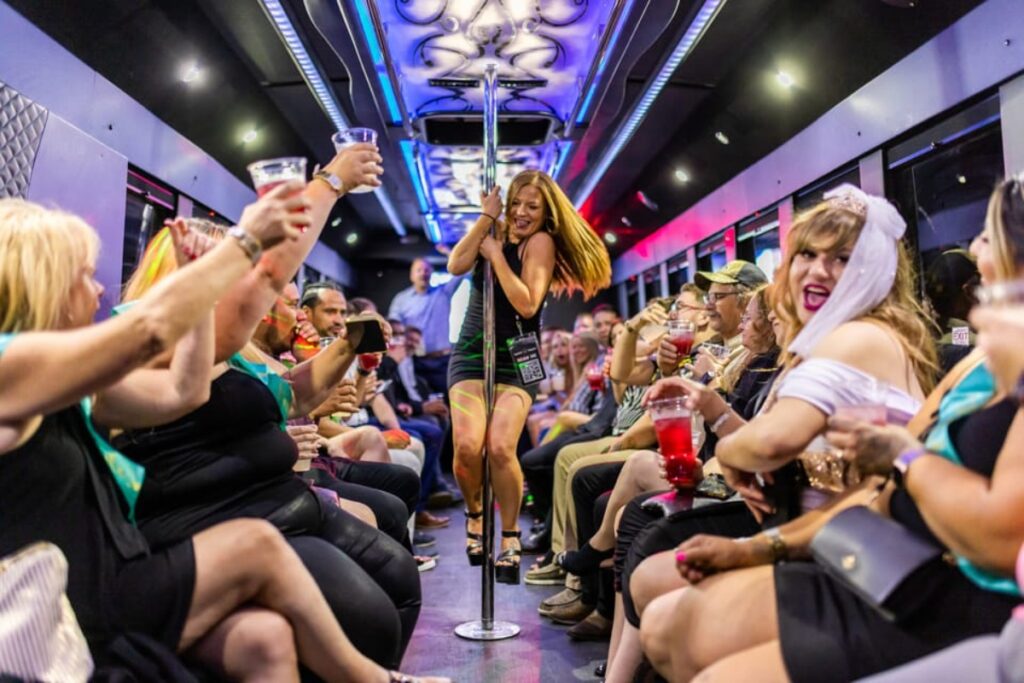 Group of friends inside a party bus with a partitioned driver's compartment in Las Vegas, Nevada