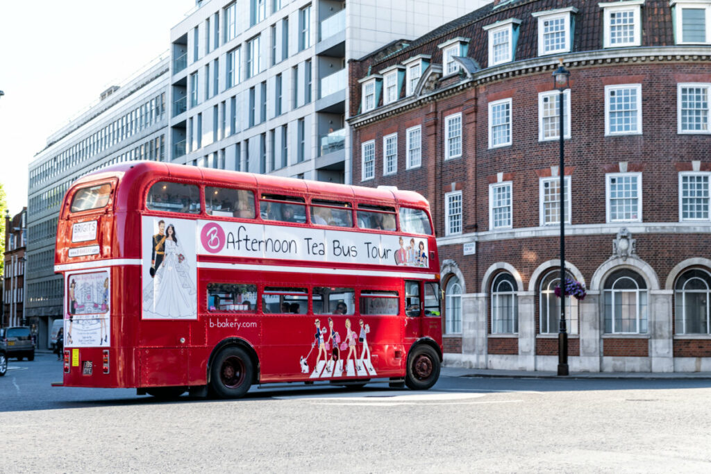 Red double decker afternoon tea bus tour in London, United Kingdom
