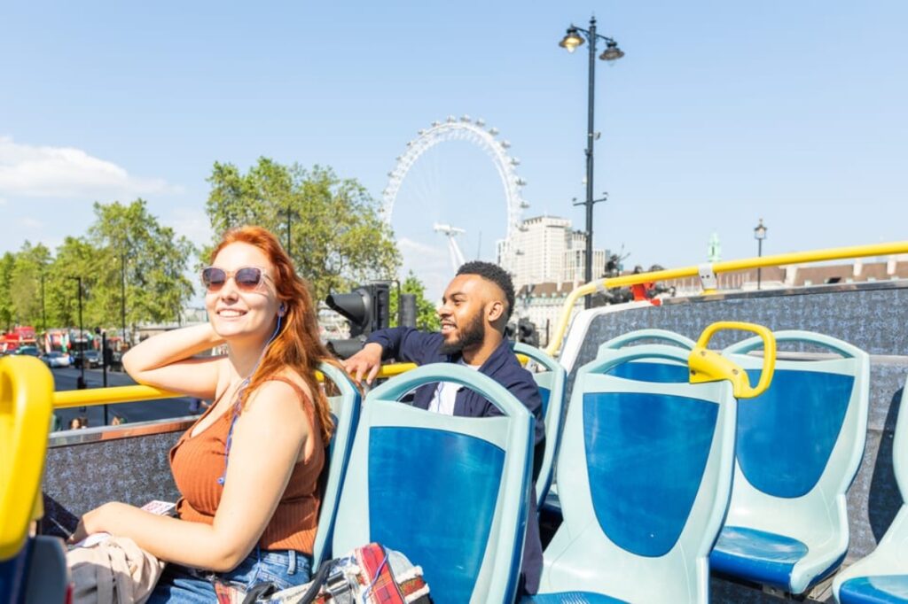 Tourists exploring London, England, on the Tootbus Hop-On Hop-Off Bus tour