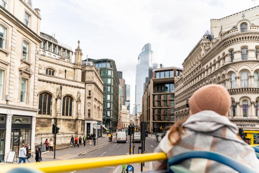 Tourist sightseeing London on a Tootbus tour bus