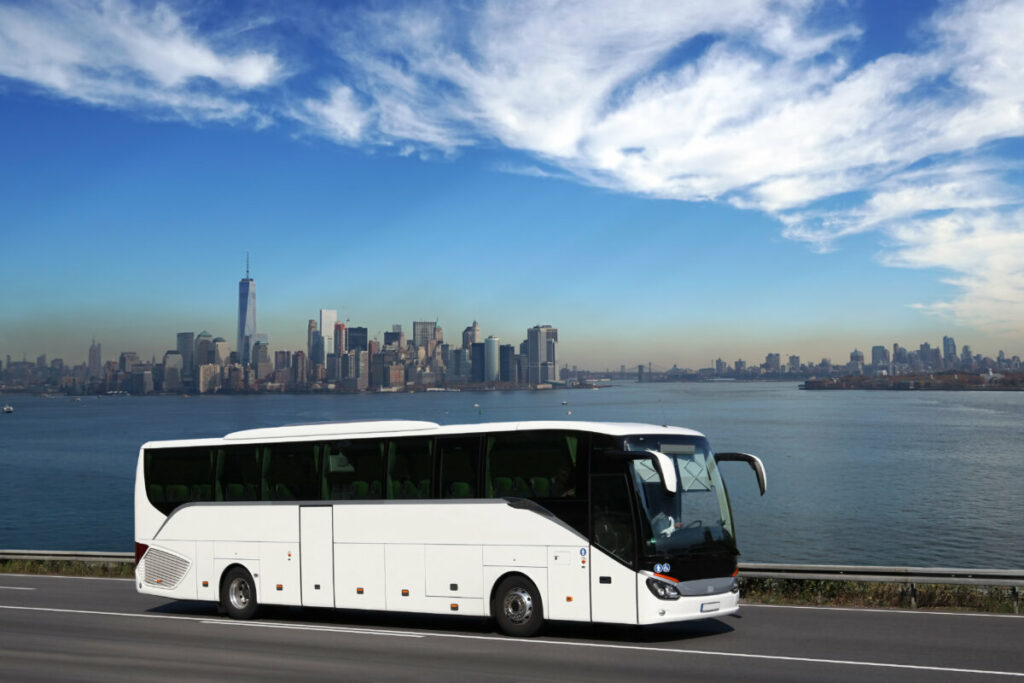 A white New York bus on a tour