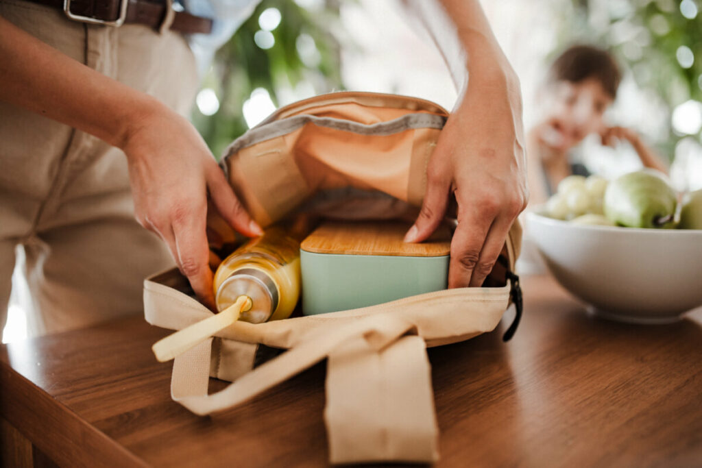 Woman preparing and packing food