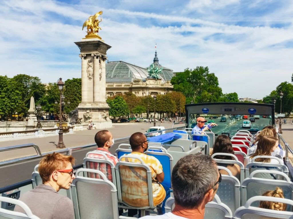 Tourists on a Paris Tootbus Tour Bus ride and sightseeing experience