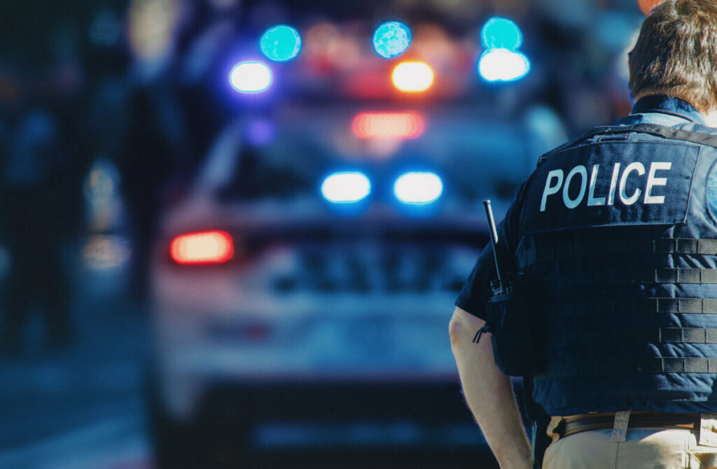 Police officer wearing a vest labeled "Police"