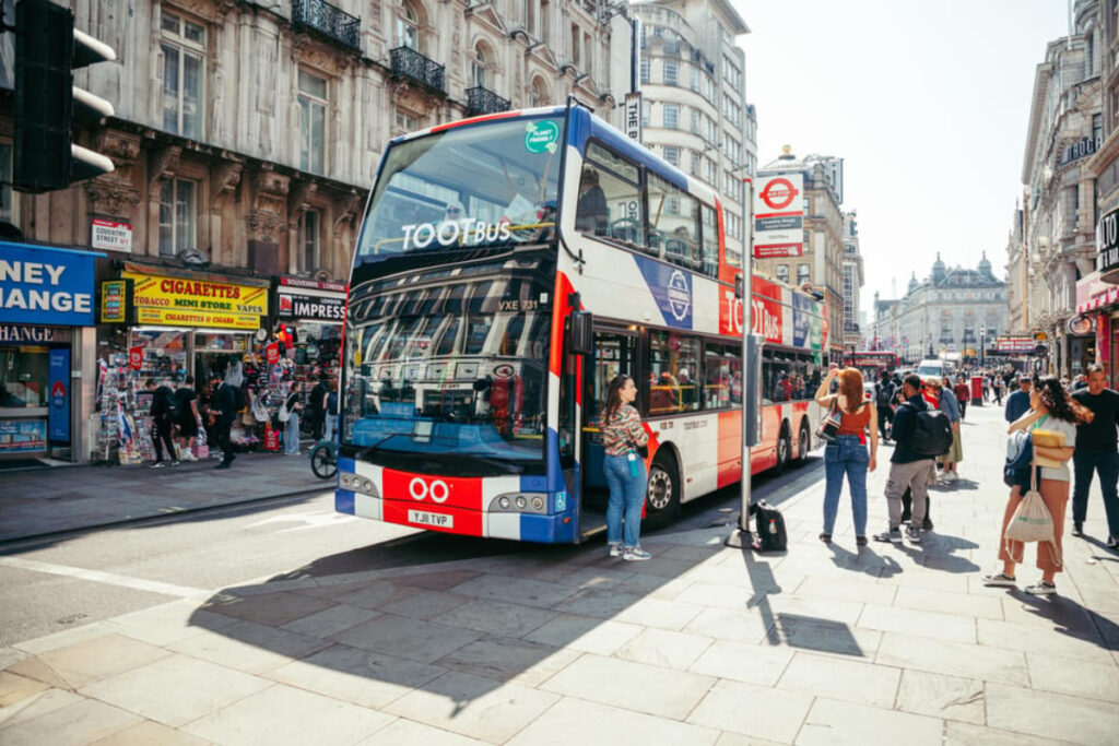 Tourists and the Tootbus tour bus in London